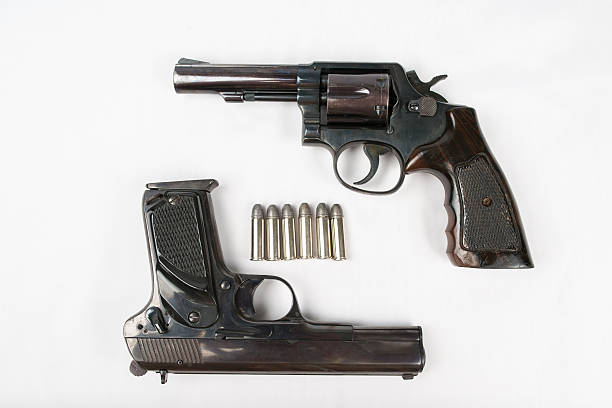 istock Black revolver gun and Semi-automatic 9mm gun on white backgroun 536856423
