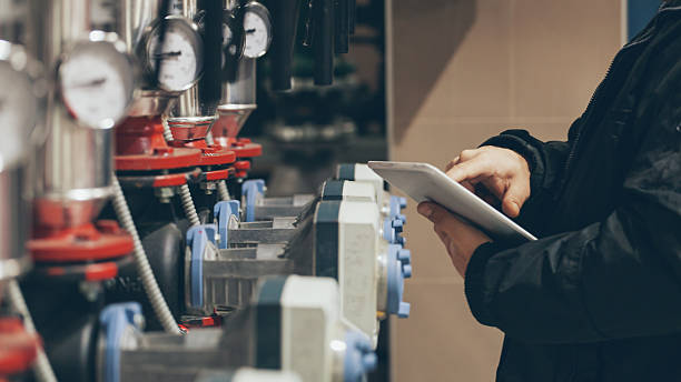 engineer at work engineer working on maintenance in boiler room pressure meter stock pictures, royalty-free photos & images