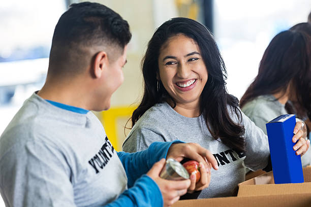 istock Hispanic woman sorting donations, volunteering with husband 536856781
