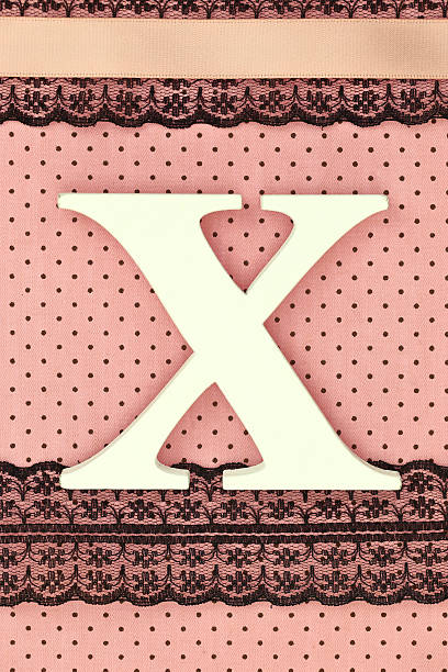 istock Wooden letter X on polka dots background 536874569