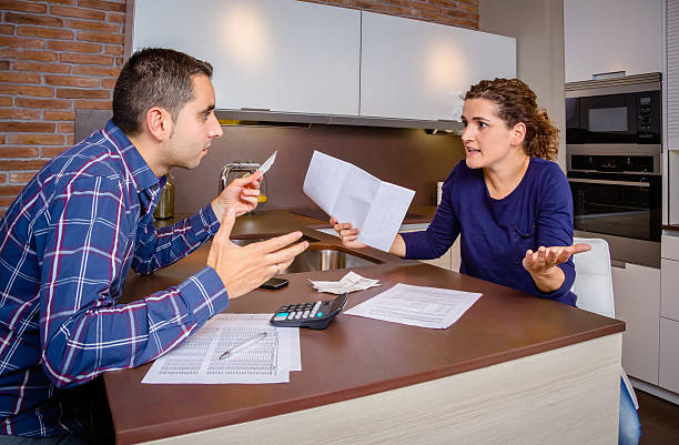 istock Angry young couple arguing by credit card debts 536875219