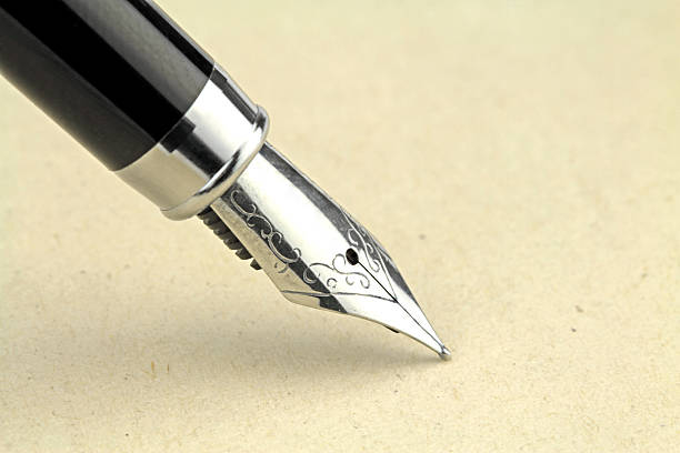 istock Fountain pen on  brown paper 536875900