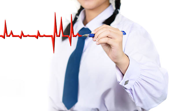 istock girl student in school uniform is hand drawing chart electrocadiogram 536877031