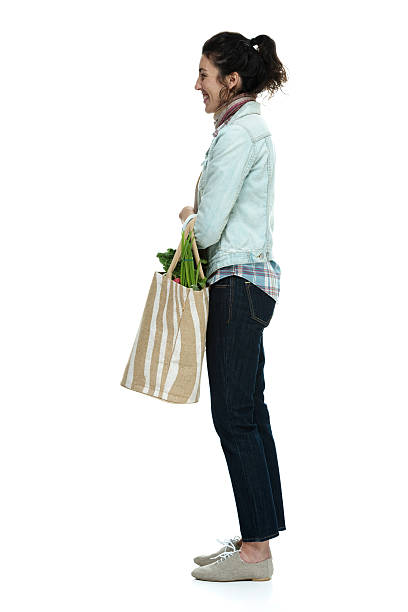istock Smiling woman holding vegetable bag 536890337