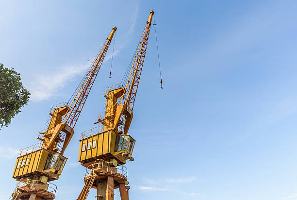 istock Old yellow crane at harbor 536890698