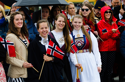 Bergen, Norway - May 17, 2016: People in Bergen during Constitution Day 17th of May. Women in traditional Norwegian dresses (\