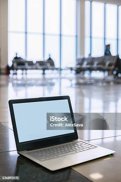 Laptop On The Floor In The Airport Terminal Stock Photo - Download Image Now - 2015, Blank, Chair