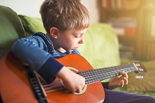 istock Little boy playing the guitar 536893961