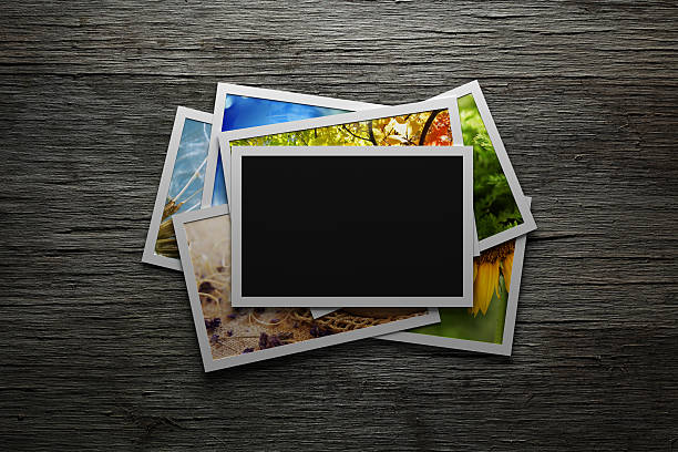 istock Pile of colorful photos with blank frame 536893963