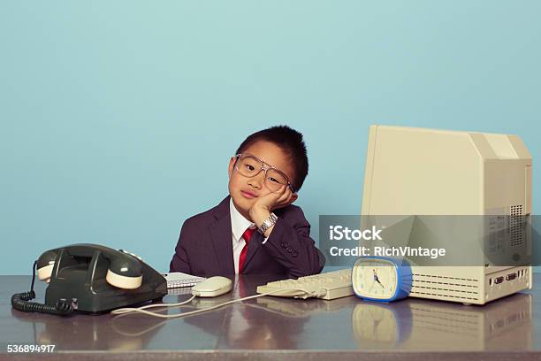 Young Japanese Boy Tired At The Office Stock Photo - Download Image Now - Boredom, Child, Problems