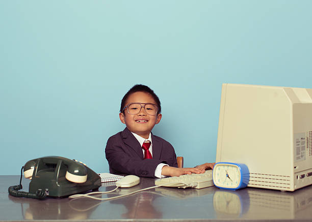istock Young Japanese Boy Businessman Smiles in Office 536894921