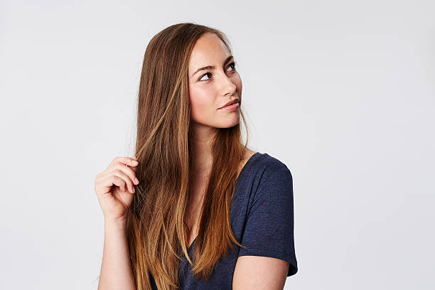 istock Contemplating woman in white studio 536905266