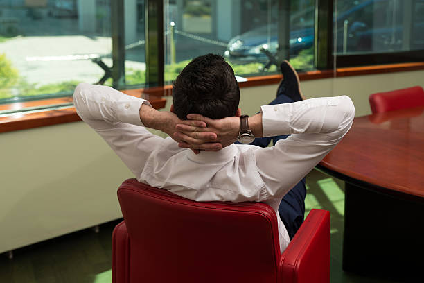 istock Young Businessman Relaxes Sitting In The Office 536917533