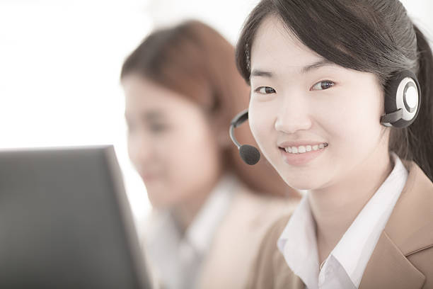 istock Asian women call center with phone headset 536922019