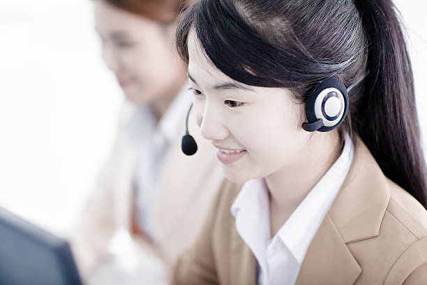 istock Asian women call center with phone headset 536922125