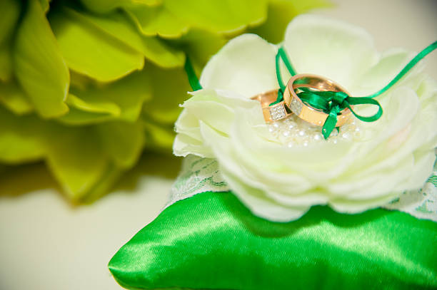 istock wedding rings lie on a green cushion for rings 536922645