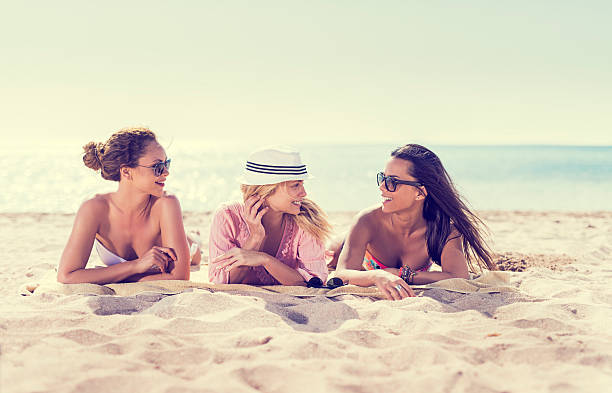 istock Young women talking on the beach. 536923173