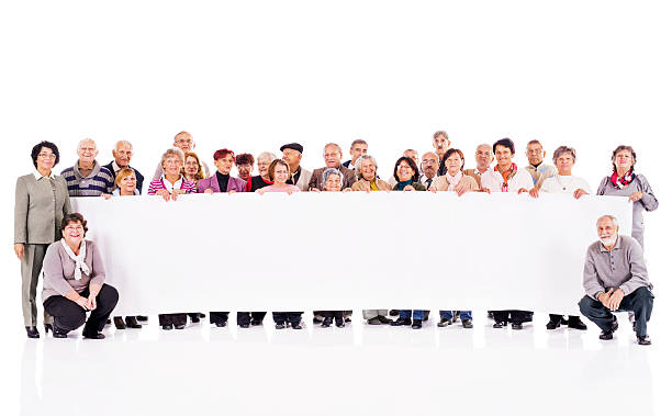 istock Group of seniors holding banner. 536923675