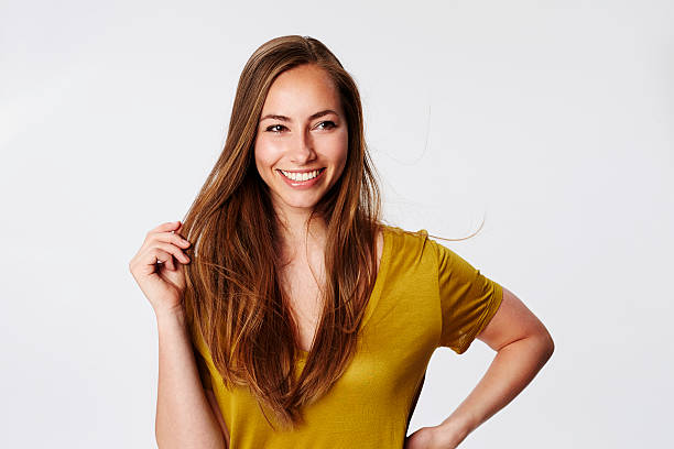 istock Smiling and beautiful brunette in white studio 536937740