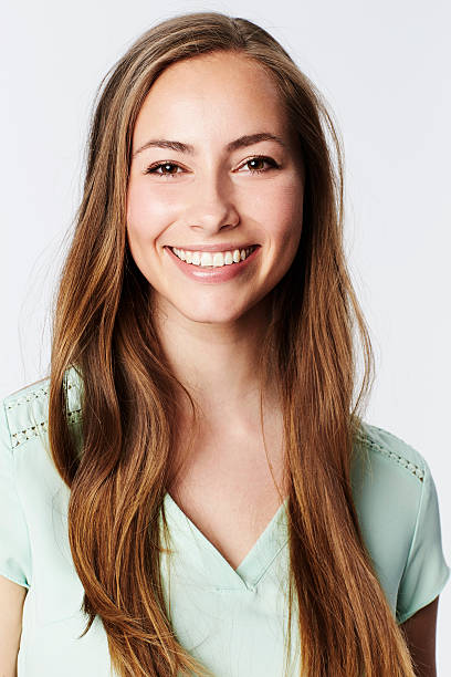 istock Smiling brunette in white studio, portrait 536947184