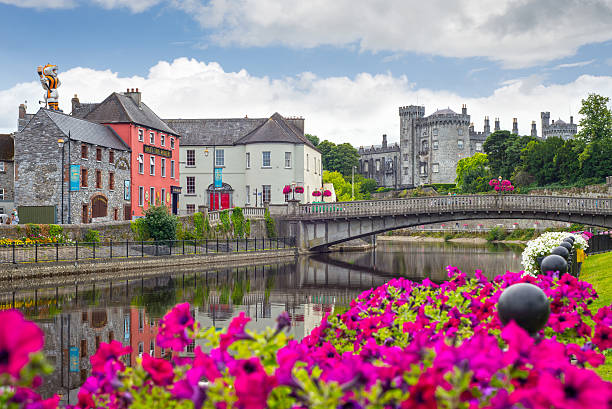 riverside view of kilkenny castle town and bridge stock photo