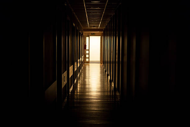 istock light at the end of corridor 536951173