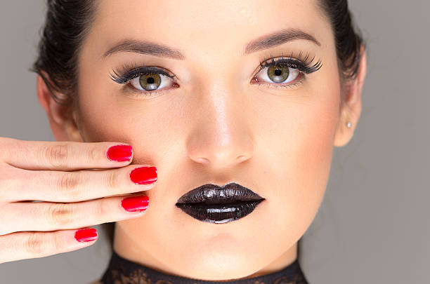 istock young gothic beautiful woman with red nails 536951539
