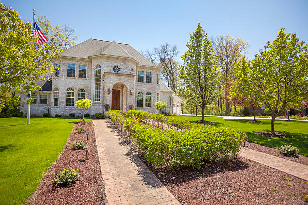 istock Stately mansion home with landscaped front yard, cobblestone sidewalk 536953196