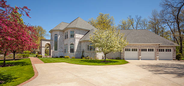 istock Stately mansion home with blossoming trees, three stall garage. 536953882