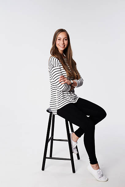 Beautiful brunette on stool, portrait stock photo
