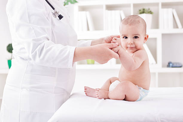 istock Doctor with baby doing  exercises 536955485