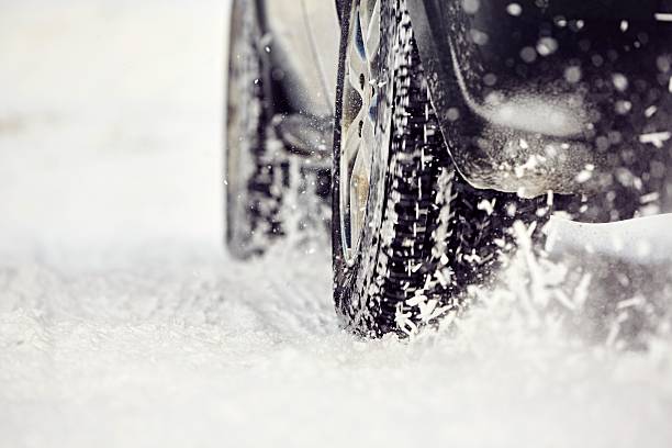 istock Tire on winter road 536956957