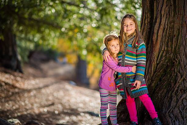 istock Sisters Portrait in the Park 536957121