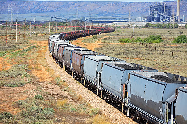 istock Loaded coal train arriving at power station 536957293