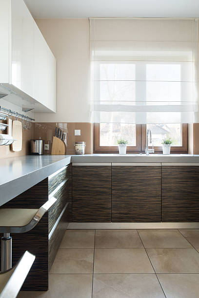 istock Brown and white kitchen furniture 536957339