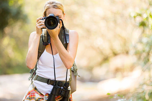 istock young hiker taking photos in mountain 536957739