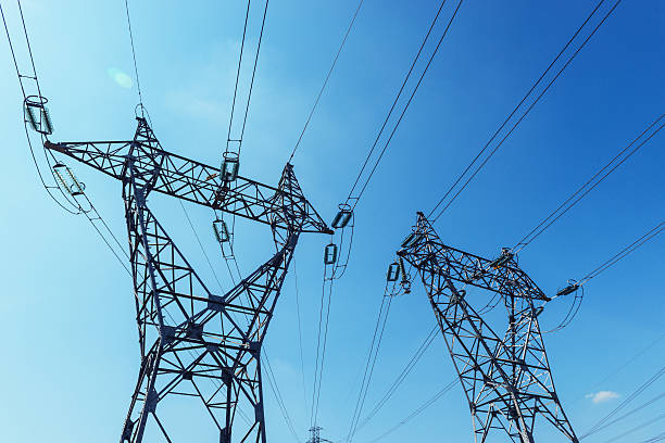 istock Electricity pylon and posts with wires against sky 536971843