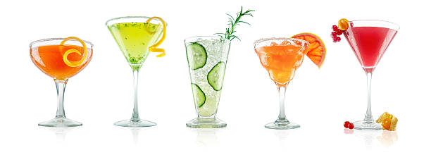 Unusual and Exotic Coctail Collection Collection of unusual and exotic cocktails, shot on white with slight surface reflections.  From left to right they are, Apple Jack Side Car, Thai Basil Lemon Drop, Cucumber Collins with Rosmary Sprig, Ruby Red Grapefruit Margarita, and Red Currant and Cape Gooseberry Gimlet. sidecar photos stock pictures, royalty-free photos & images