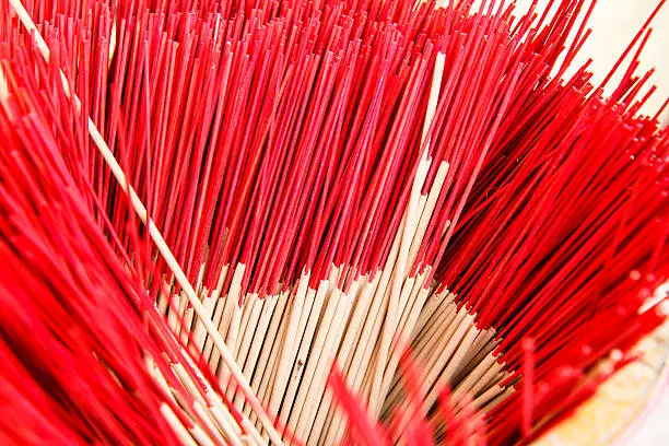 red  incense in a buddhist temple