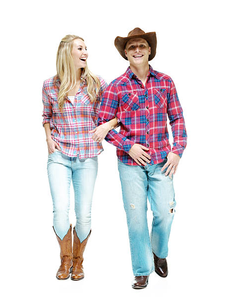 istock Smiling cowboy couple walking together 536973077