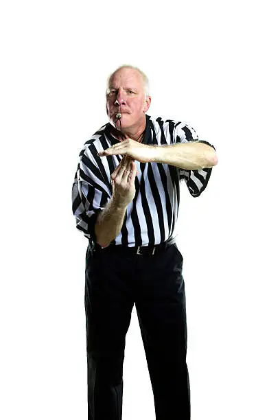 Basketball referee signaling a technical foul