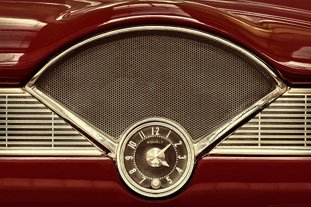 Clock inside a classic fifties car Clock on the dashboard of a maroon classic fifties car technology in the 1940s stock pictures, royalty-free photos & images