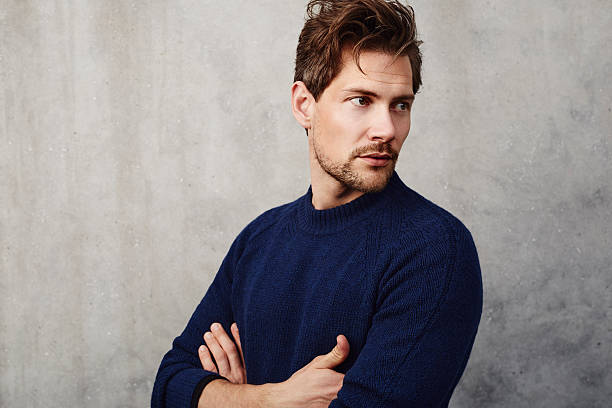istock Handsome guy in blue sweater, looking away 536975516