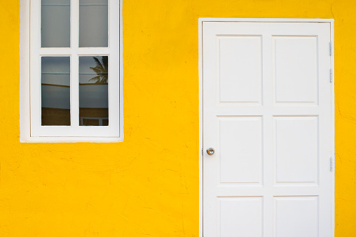Door and windows in white and yellow.