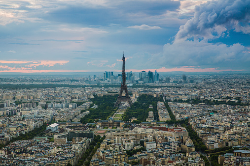 Aerial view on Paris with Eiffel Tower and La Defense in the background.