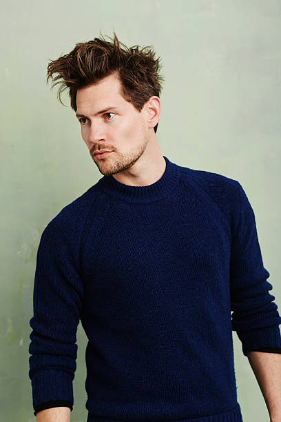 istock Handsome dude in blue sweater, looking away 536998118
