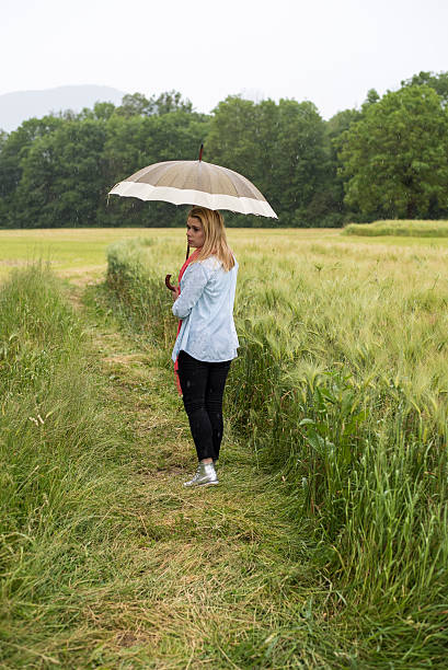 istock Woman walking through wheat field 537007362