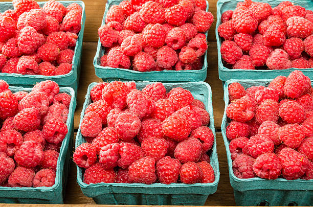 istock Fresh red raspberries on display at the market 537014533