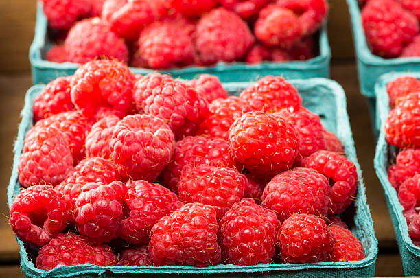 istock Fresh red raspberries on display at the market 537014539