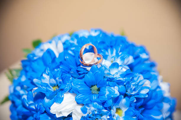 istock wedding rings lie on a bouquet 537016269